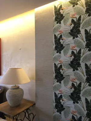 a lamp sitting on a table next to a wall at Hotel Parque das Laranjeiras in Vilamoura