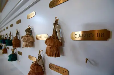 a wall with tassels and signs on a wall at Vila Recife Hotel in Albufeira