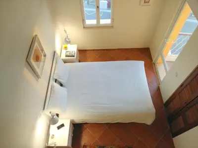 a bedroom with a white bed in the attic at TP Aqua Marina, Vilamoura Triplex Apartment in Quarteira