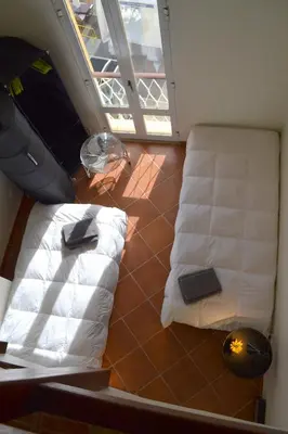 a room with two white pillows on the floor at TP Aqua Marina, Vilamoura Triplex Apartment in Quarteira