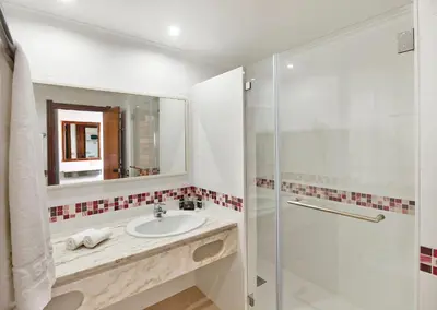 a bathroom with a sink and a shower at Hotel Apartamento Brisa Sol in Albufeira