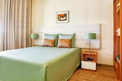a living room with a couch and two chairs at Ondamar Hotel Apartamentos in Albufeira