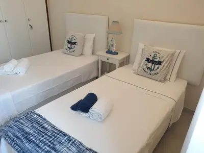 two beds with towels on them in a room at Vilamoura-Nautic Apartment in Vilamoura