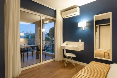 a beach with a bunch of umbrellas and the ocean at AP Adriana Beach Resort in Albufeira