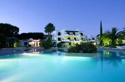 a large pool of water in front of a building at Balaia Golf Village in Albufeira