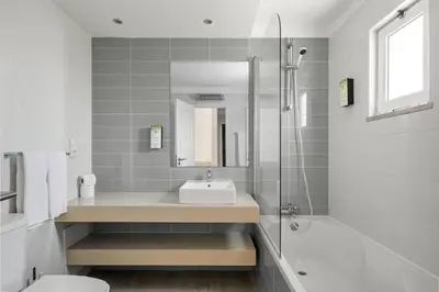 a bathroom with a sink and a shower at Balaia Golf Village in Albufeira