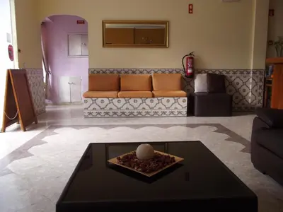 a living room with a couch and a table at Frentomar in Albufeira