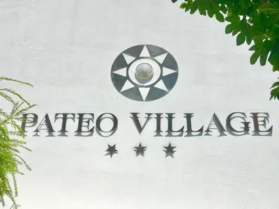 a sign on the side of a building with aelta village at Pateo Village in Albufeira