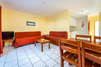 a living room with a couch and a table at Pateo Village in Albufeira