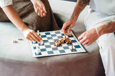 a couple playing a game of chess on a chessboard at Stay Hotel Faro Centro in Faro