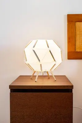 a lamp sitting on top of a wooden table at My Place @ Faro City Views in Faro