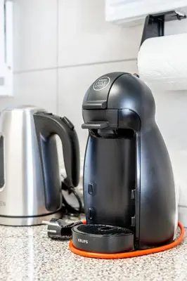 a tea kettle is sitting on a kitchen counter at My Place @ Faro City Views in Faro