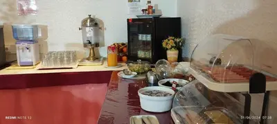 a counter in a kitchen with some food on it at Hotel Alnacir in Faro