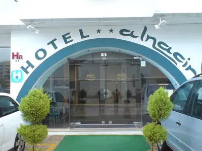 a store front with a sign that reads highton college at Hotel Alnacir in Faro