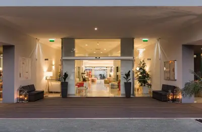 a lobby with couches and chairs in a building at 3HB Clube Humbria - All Inclusive in Albufeira
