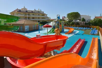 a water park with a slide and a swimming pool at 3HB Clube Humbria - All Inclusive in Albufeira