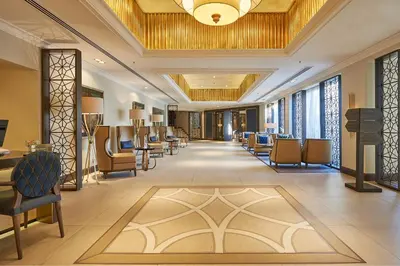 a lobby with chairs and a waiting room at Dona Filipa Hotel in Vale do Lobo
