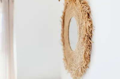 a wreath hanging on a wall with a mirror at Vila Channa - Adults Only in Albufeira