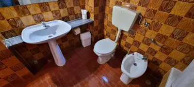 a bathroom with a sink and a toilet at Albufeira Jardim by Umbral in Albufeira