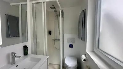 a bathroom with a shower and a sink and a toilet at Galo by Check-in Portugal in Albufeira