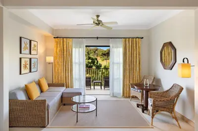 a living room with a couch and a table at Pine Cliffs Residence, a Luxury Collection Resort, Algarve in Albufeira