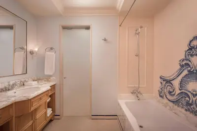 a bathroom with a tub and two sinks and a shower at Pine Cliffs Residence, a Luxury Collection Resort, Algarve in Albufeira