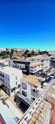 an aerial view of a city with buildings at Albufeira Beach Hotel by Kavia in Albufeira