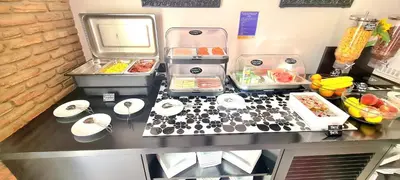 a kitchen counter with food on top of it at Albufeira Beach Hotel by Kavia in Albufeira