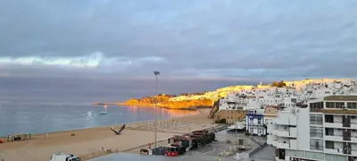 a view of a beach with buildings and the ocean at Albufeira Beach Hotel by Kavia in Albufeira