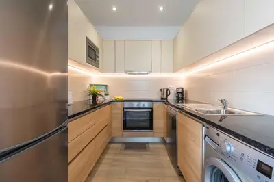 a kitchen with a sink and a dishwasher at Casa Mar d'Alma - 100m from the Beach in Albufeira