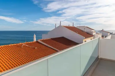a view of the ocean from the roof of a building at Casa Mar d'Alma - 100m from the Beach in Albufeira