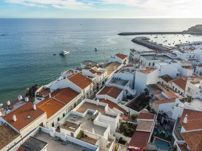 an aerial view of a town next to the ocean at Casa Mar d'Alma - 100m from the Beach in Albufeira
