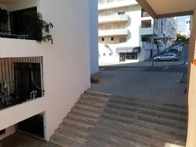a stairway leading up to a building at T2 Tahíti - Terraço, Familiar, Garagem, Wifi in Quarteira