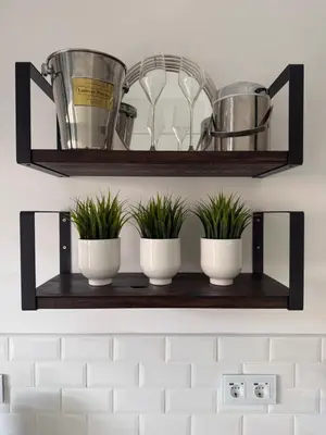 a black shelving unit in a room with drinks on it at Vila Sol, Apartment 468 in Quarteira