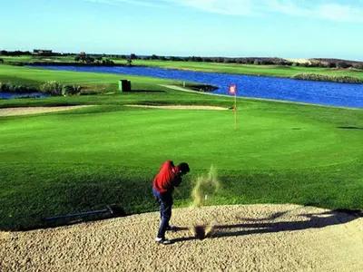 a man is standing on a golf course at V3, Villa Belo Horizonte near Beach, Albufeira in Albufeira