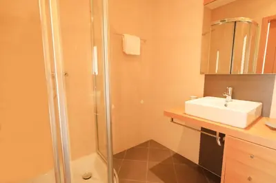 a bathroom with a sink and a shower at Balaia Harmonia in Albufeira