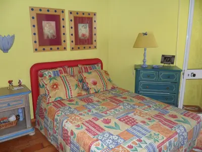 a bedroom with a bed with a blue dresser and a bed sidx sidx sidx at Casa na praia e golfe in Vale do Lobo