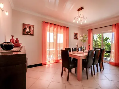a dining room with a table and chairs at Luxury Holiday Villa Alegria Galé Beach, Albufeira in Albufeira