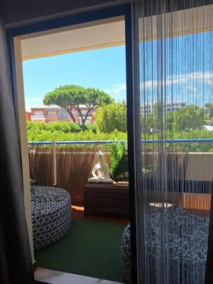 a couch sitting in a room with a table at Apartament Olhos do Mar T1 beach Olhos de Água in Albufeira