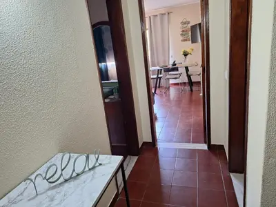 a bathroom with a sink and a mirror and a tub at Apartament Olhos do Mar T1 beach Olhos de Água in Albufeira