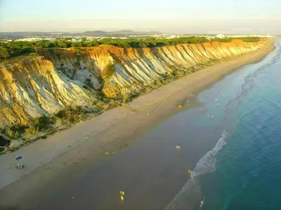 an aerial view of a beach with cliffs and the ocean at Charming Apartment in Albufeira, 60 m², Mountain View in Albufeira