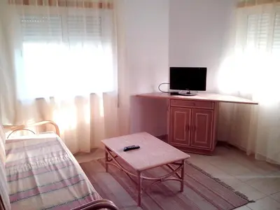 a living room with a tv and a coffee table at Charming Apartment in Albufeira, 60 m², Mountain View in Albufeira