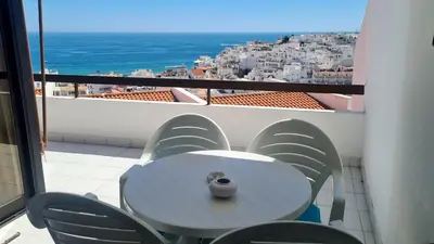 a table and chairs on a balcony with a view at Albufeira Ocean Terrace (31) in Albufeira