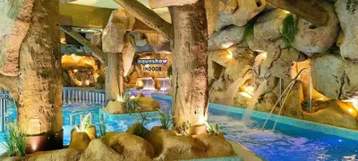 a large indoor swimming pool in a resort at Vista Mar in Quarteira