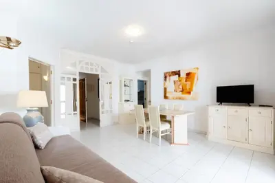 a living room with a couch and a table at Atlantida by Garvetur in Quarteira