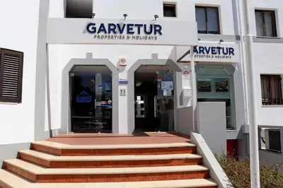 a building with stairs in front of a building at Algardia Marina Parque by Garvetur in Vilamoura