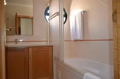 a bathroom with a tub and a sink and a shower at Eden Vilage by Garvetur in Vilamoura