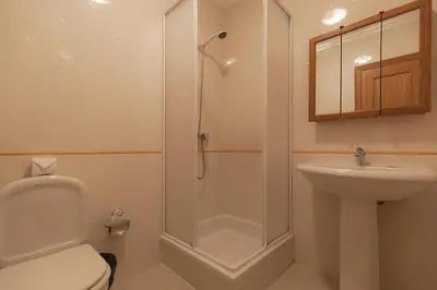 a bathroom with a shower and a toilet and a sink at Eden Vilage by Garvetur in Vilamoura
