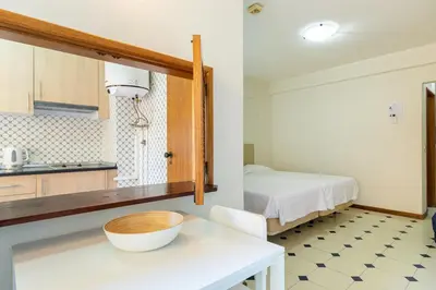 a kitchen with a table with a bowl on it at Rio by Garvetur in Vilamoura