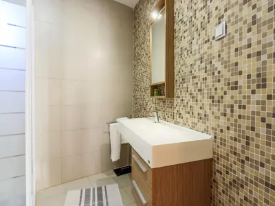a bathroom with a sink and a mirror at V4, Villa Jardins Branqueira4 near Beach, Albufeira in Albufeira